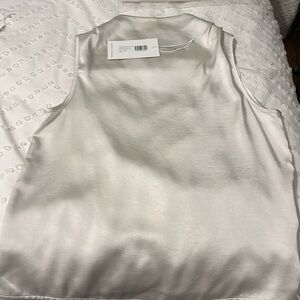 Brand new Noli shop Pearl high neck silk top. Not even taken out of the bag.